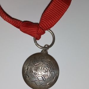 Kirk Sterling rose engraved pendant